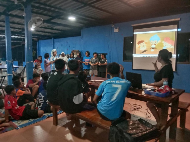 Group of people watching a movie together